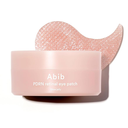 Pink container of Abib PDRN retinal eye patch with a heart-shaped applicator on a white background