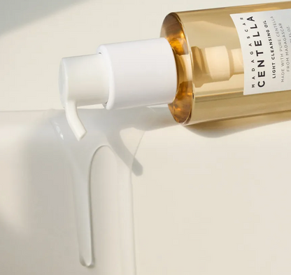 Bottle of Madara skincare product being dispensed onto a white applicator on a light background