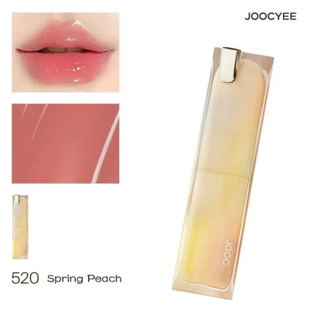 Lipstick with 'JOOCYEE' branding, shown on lips and swatched, with '520 Spring Peach' color name.