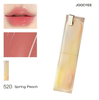 Lipstick with 'JOOCYEE' branding, shown on lips and swatched, with '520 Spring Peach' color name.
