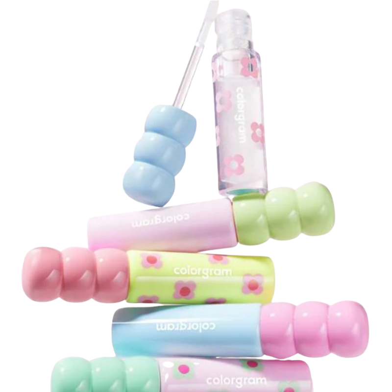 Colorful lip balm set with floral designs on a white background
