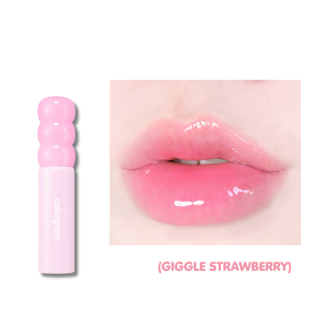 Pink lip gloss with a close-up of lips wearing the product labeled 'Giggle Strawberry'.