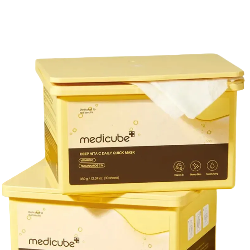 Two yellow boxes of Medicube Deep Vita C Daily Quick Mask on a beige background
